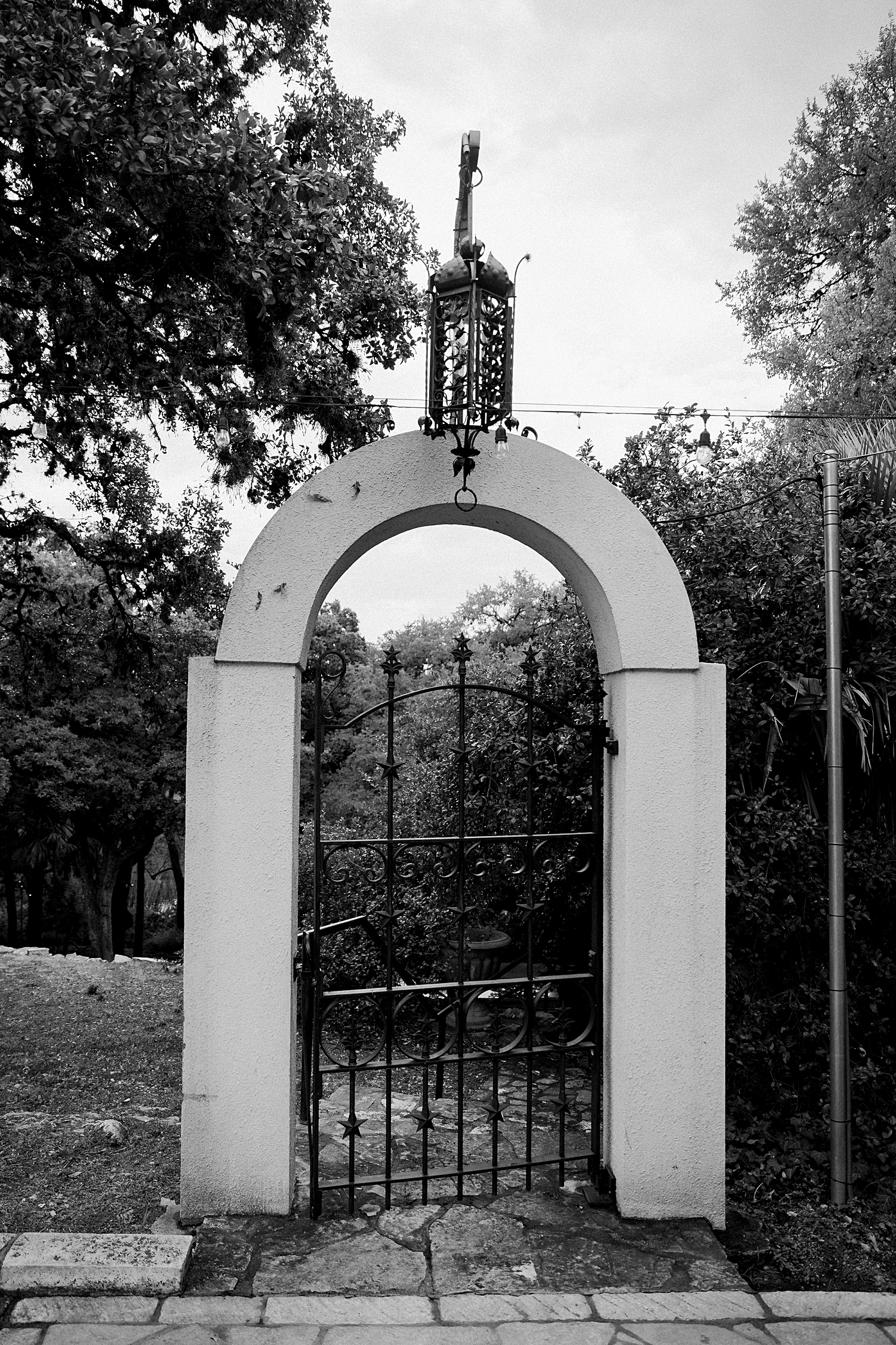 Laguna Gloria Austin spanish gate in garden black and white
