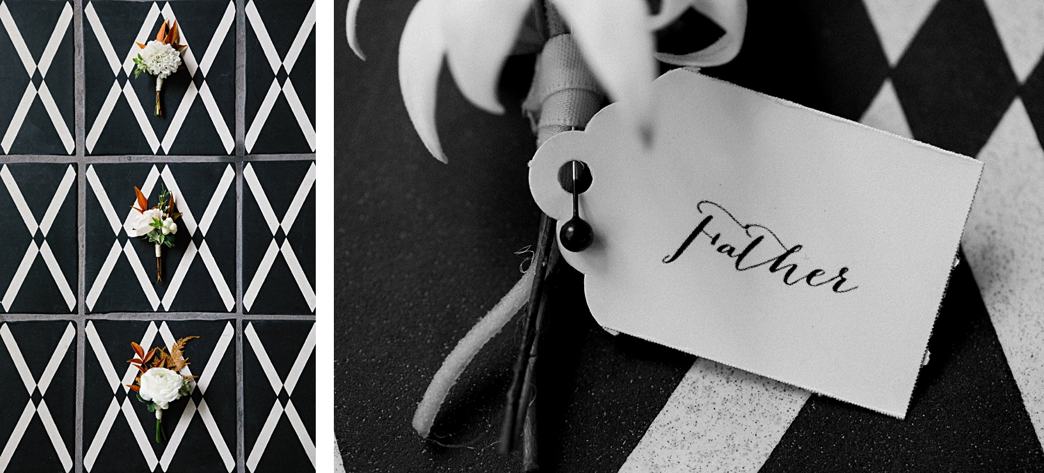 boutonniere white and gold laying on black and white tile