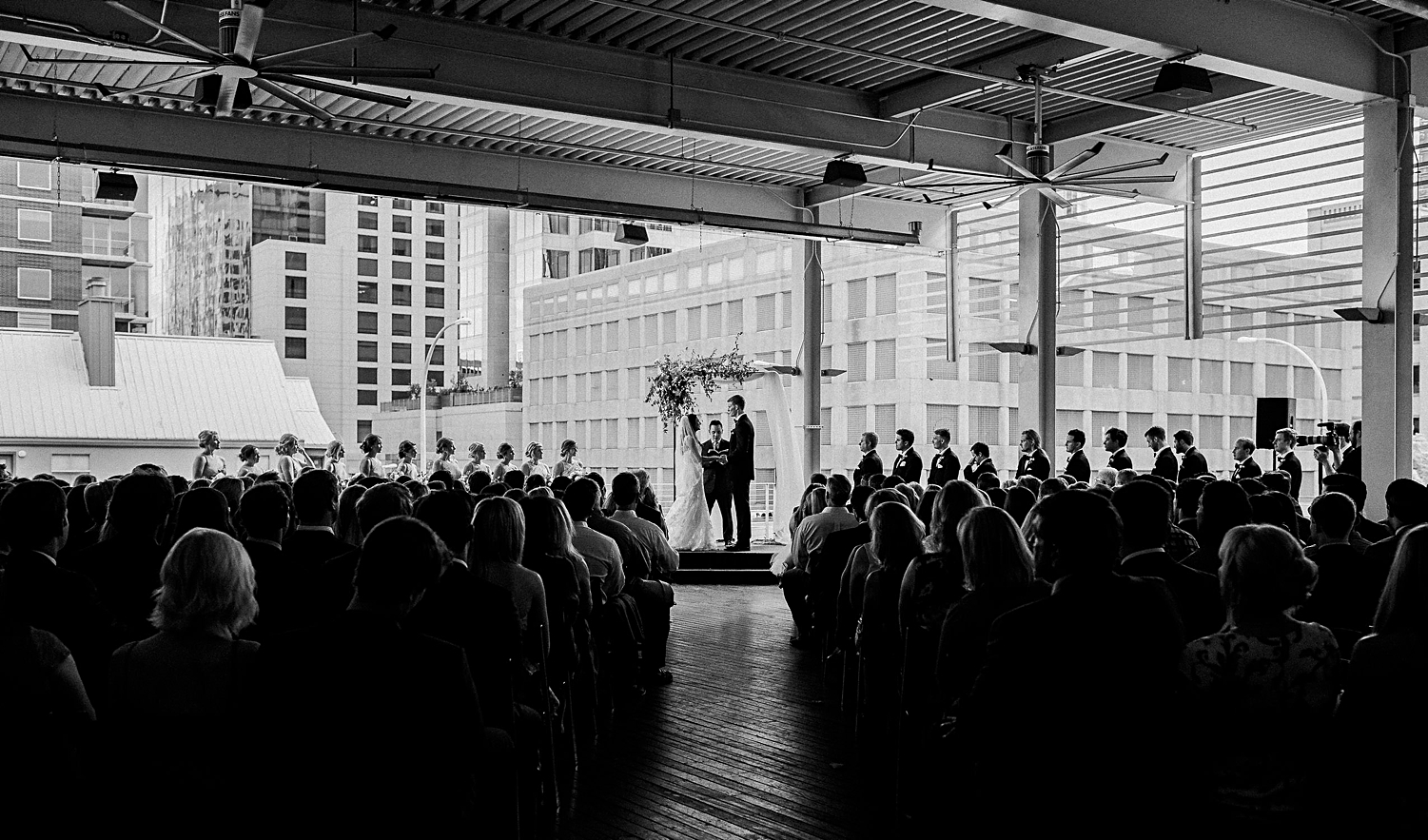 Bride and groom at altar covered patio downtown Austin Brazos Hall Venue