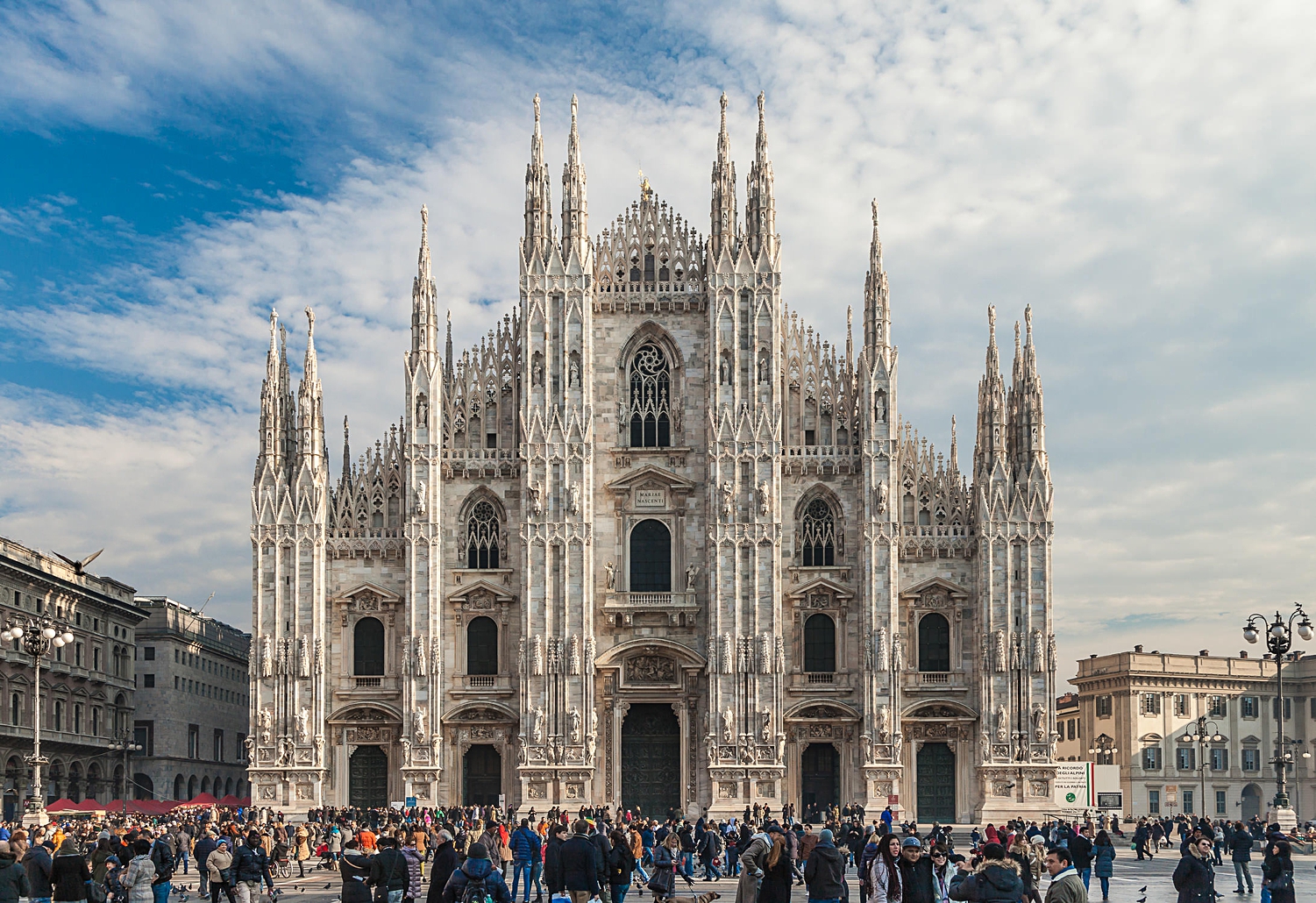 Milan cathedral front against blue sky and clouds Milano Italy 