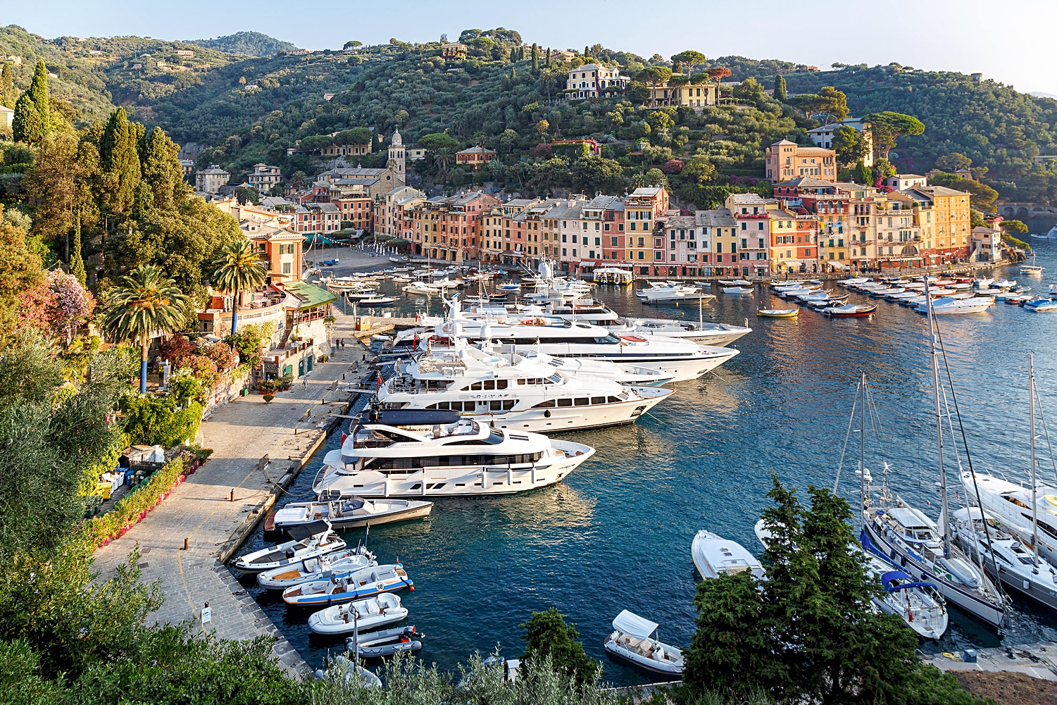 Portofino Italy small village on blue ocean bay with white yachts docked
