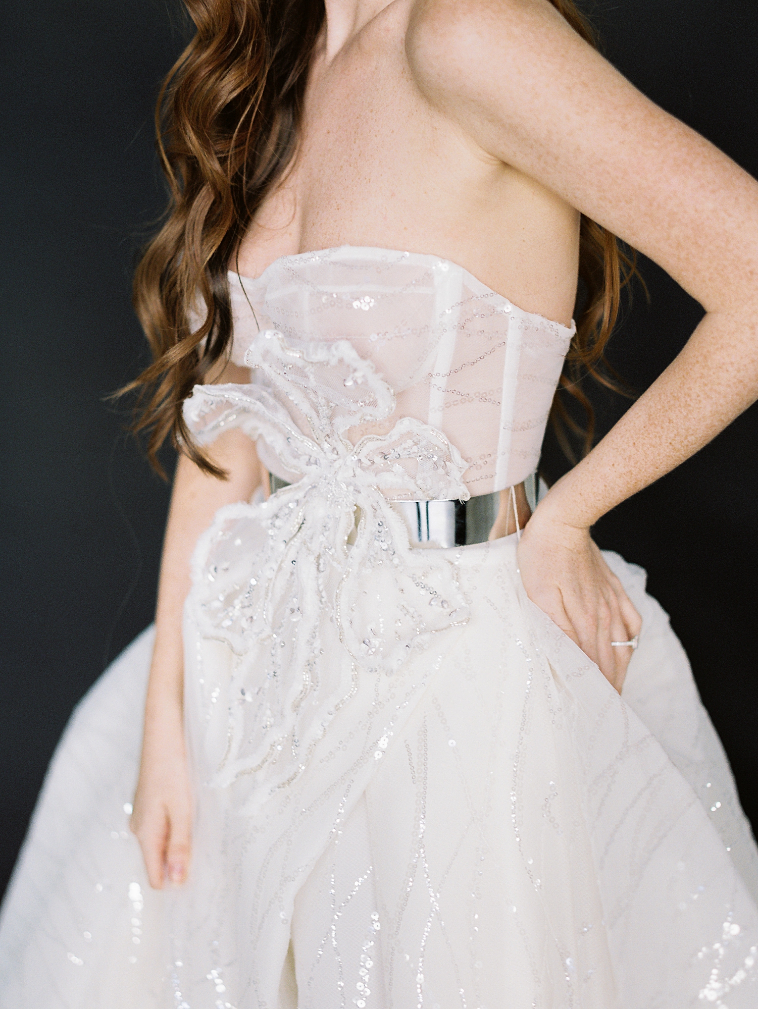 girls midriff in sparkling white wedding gown silver belt