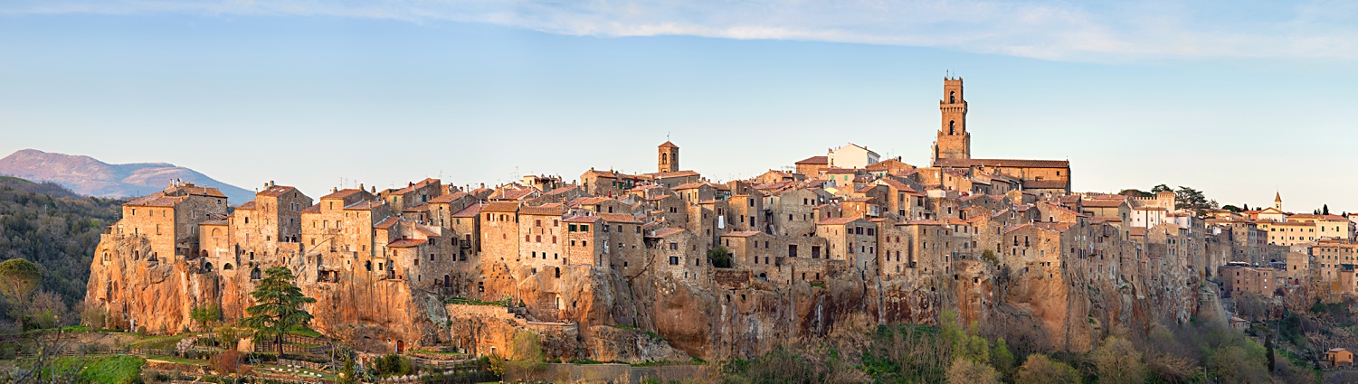 Pitigliano Tuscany Italy hill town medieval walled sunset landscape