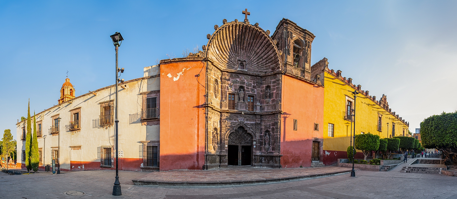 San Miguel Church street facade orange and yellow buildings