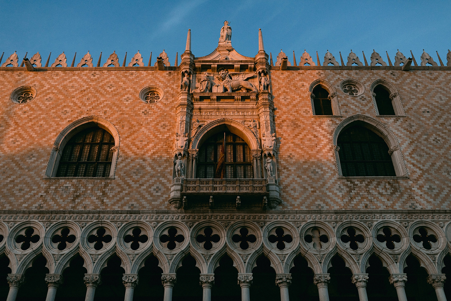 Top of Doge's Palace in Palazzo Ducale at sunset with blue sky