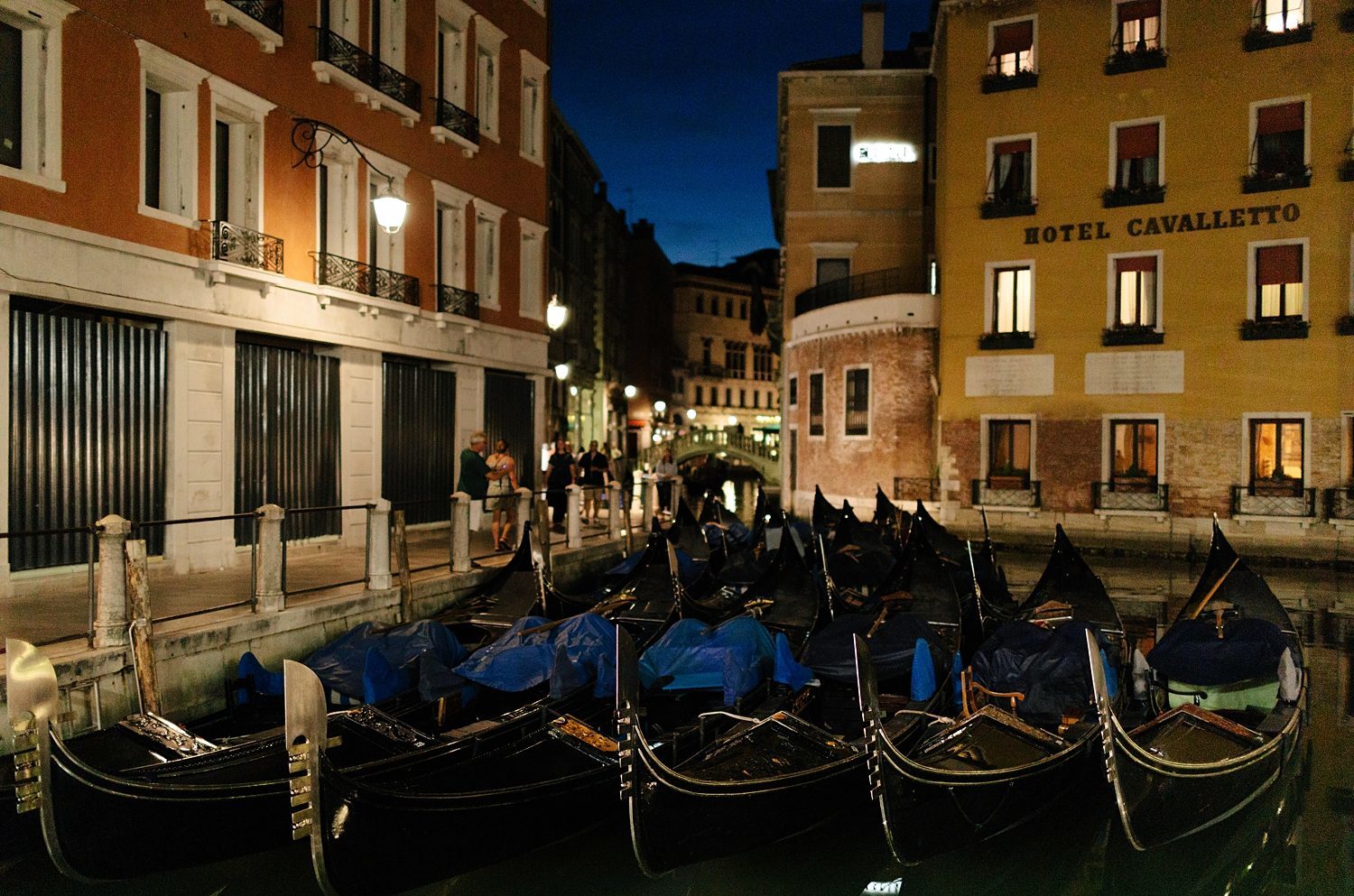 Nighttime Venice Lights gondolas docked Italy