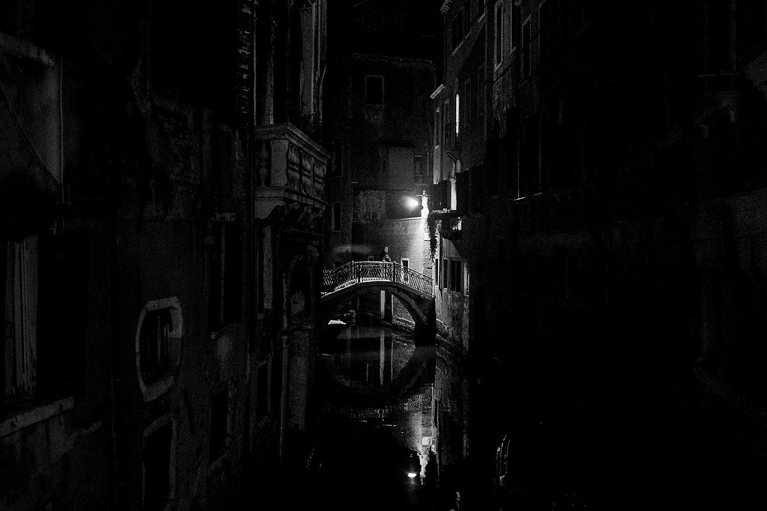 dark Nighttime Venice canal and bridge black and white electric Light