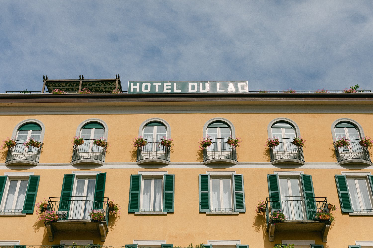 yellow facade of hotel Du Lag Italy 