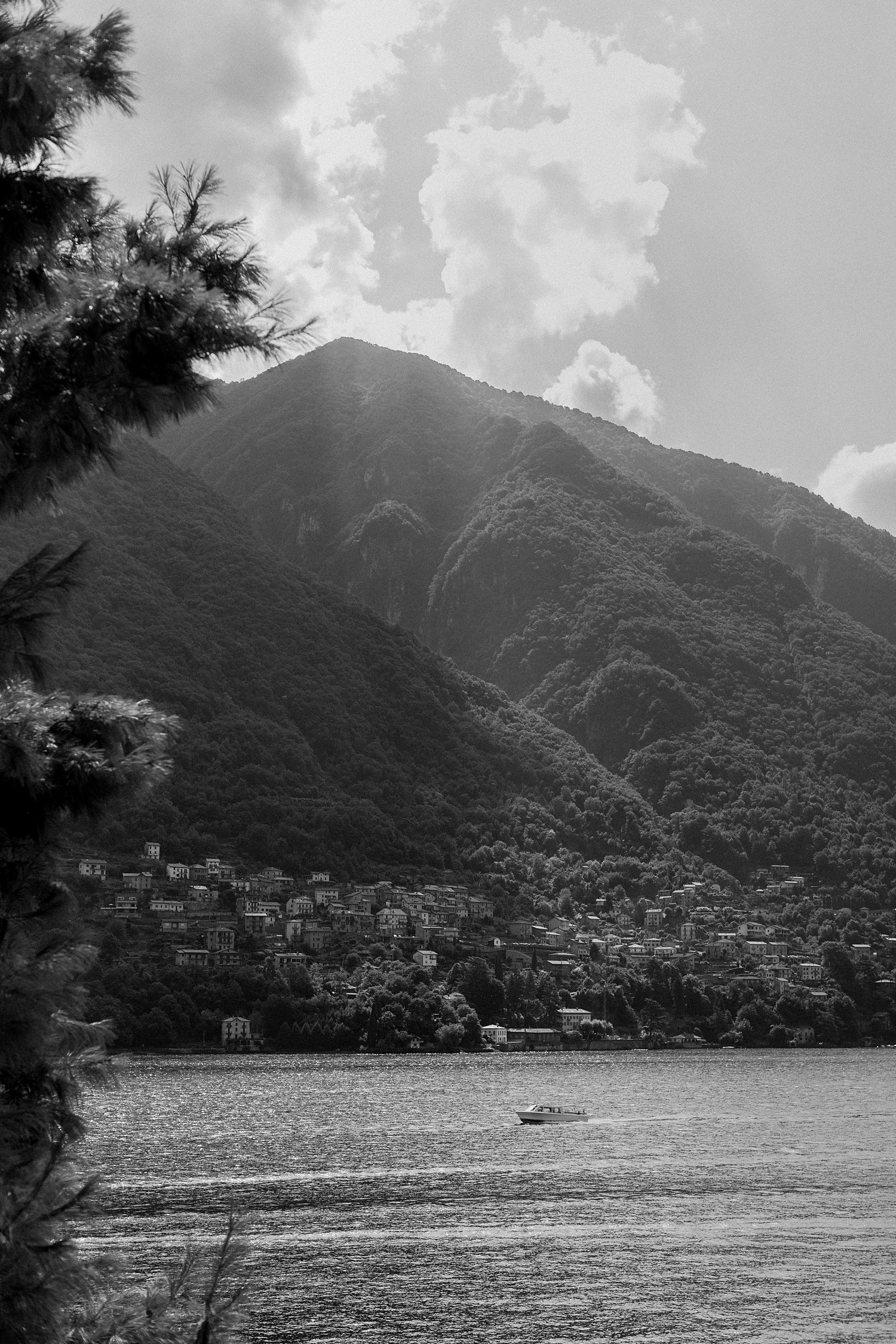 Black and white Lake Como Italy village mountain against sky