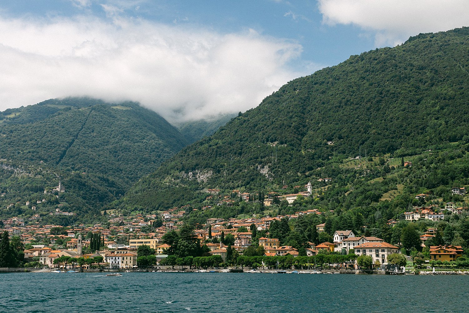 View of Lake Como Italy town on green mountains
