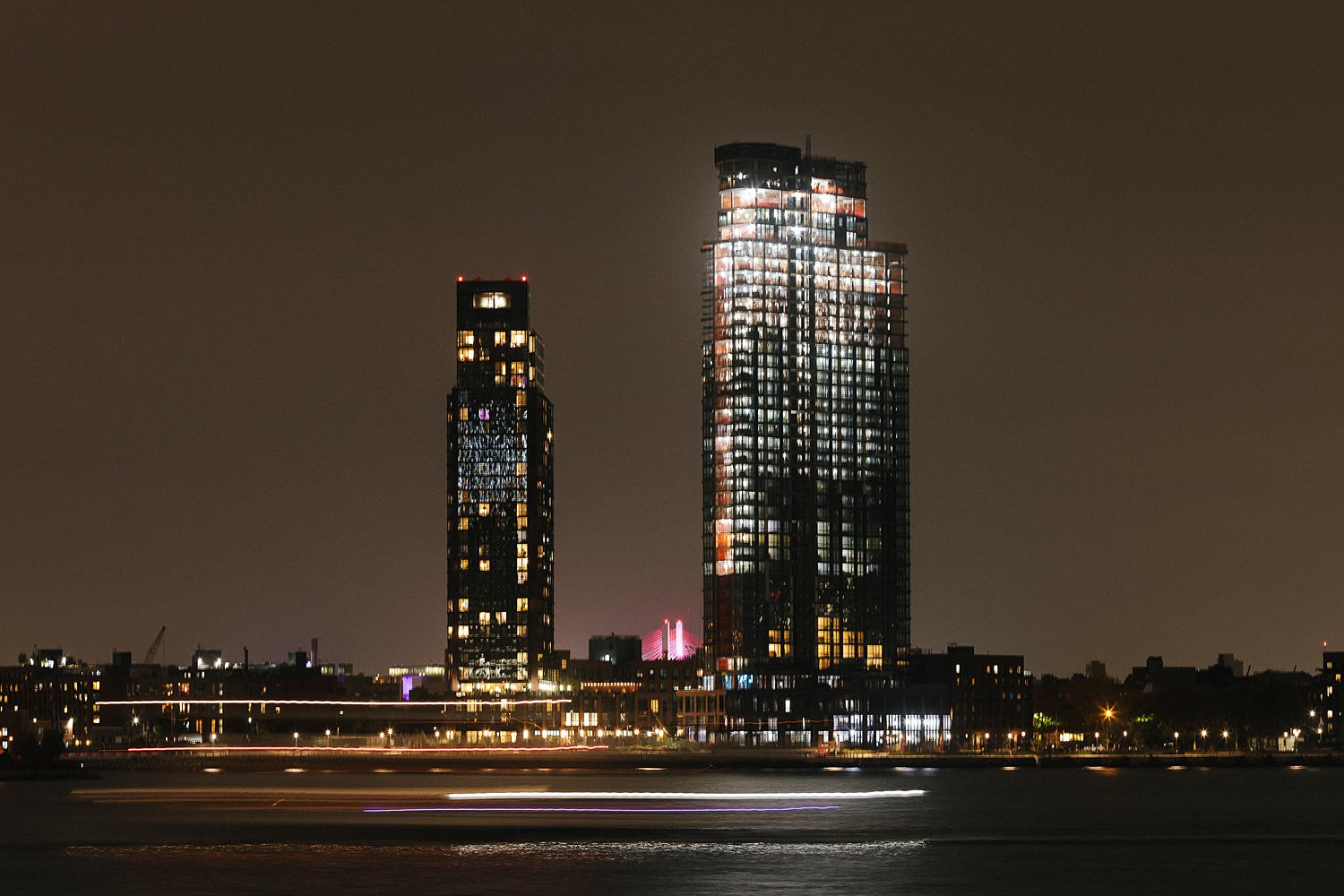 Brooklyn buildings at night illuminated NYC skyscraper East River