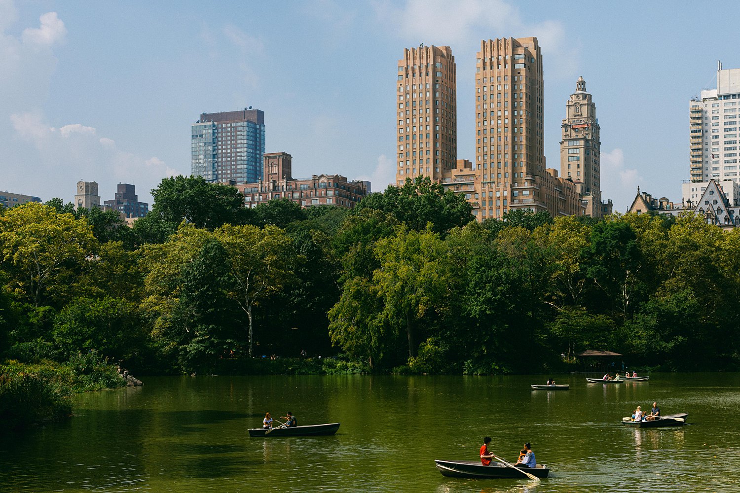 Central Park west pond rowboats and skyline places to visit in new york