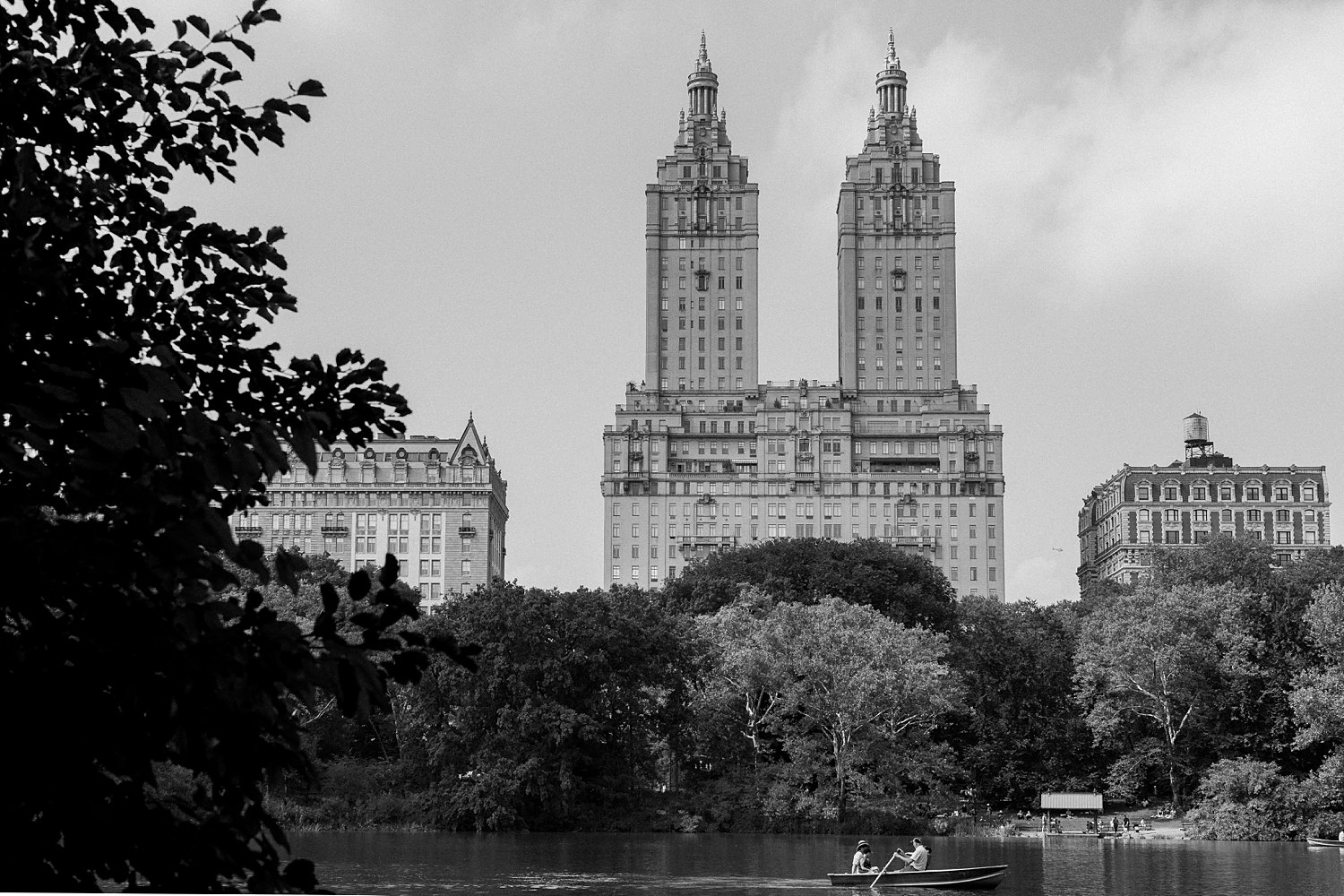 Central Park west pond rowboats and skyline towers