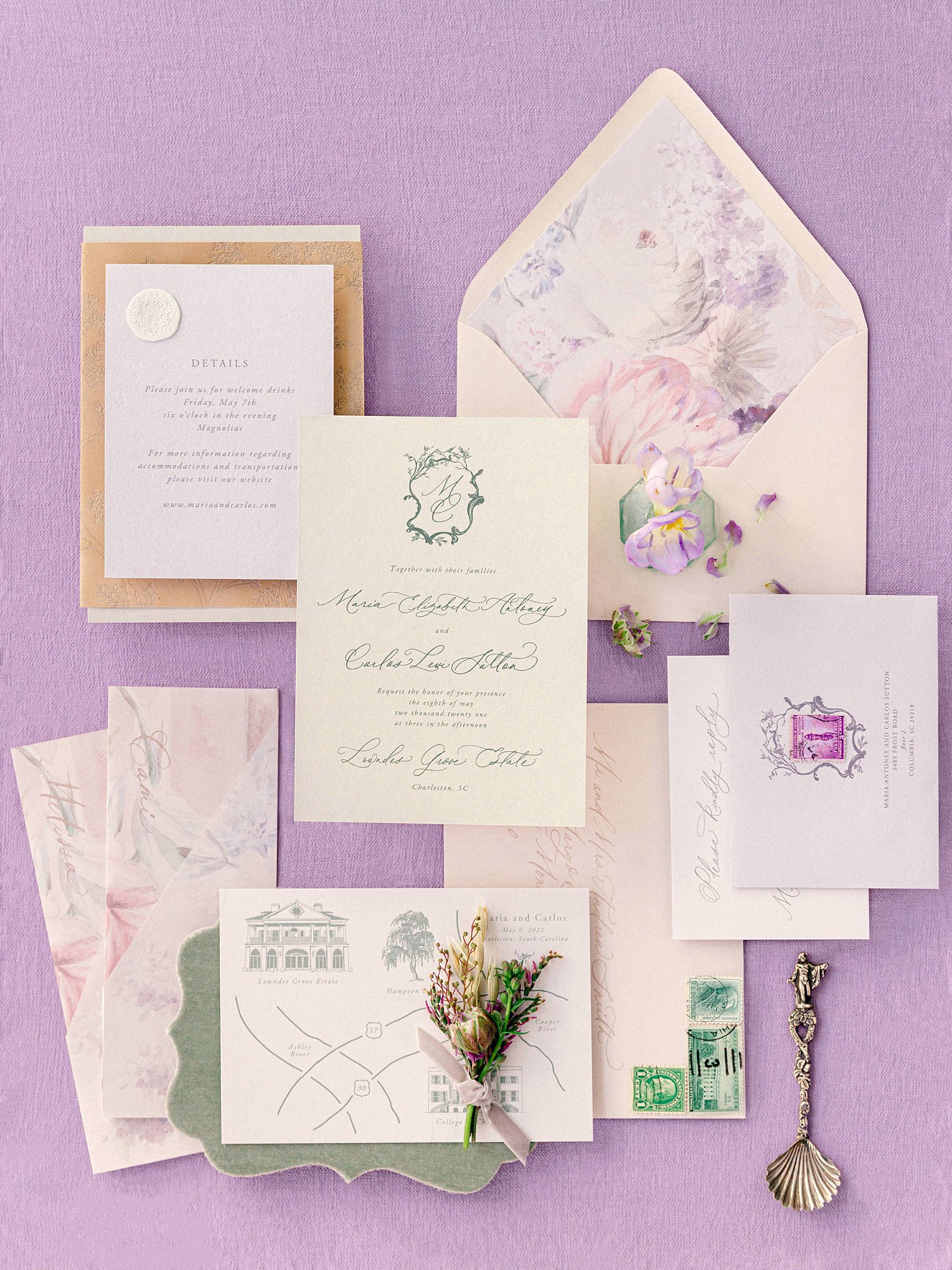 wedding paper invitation suite against purple background flatlay