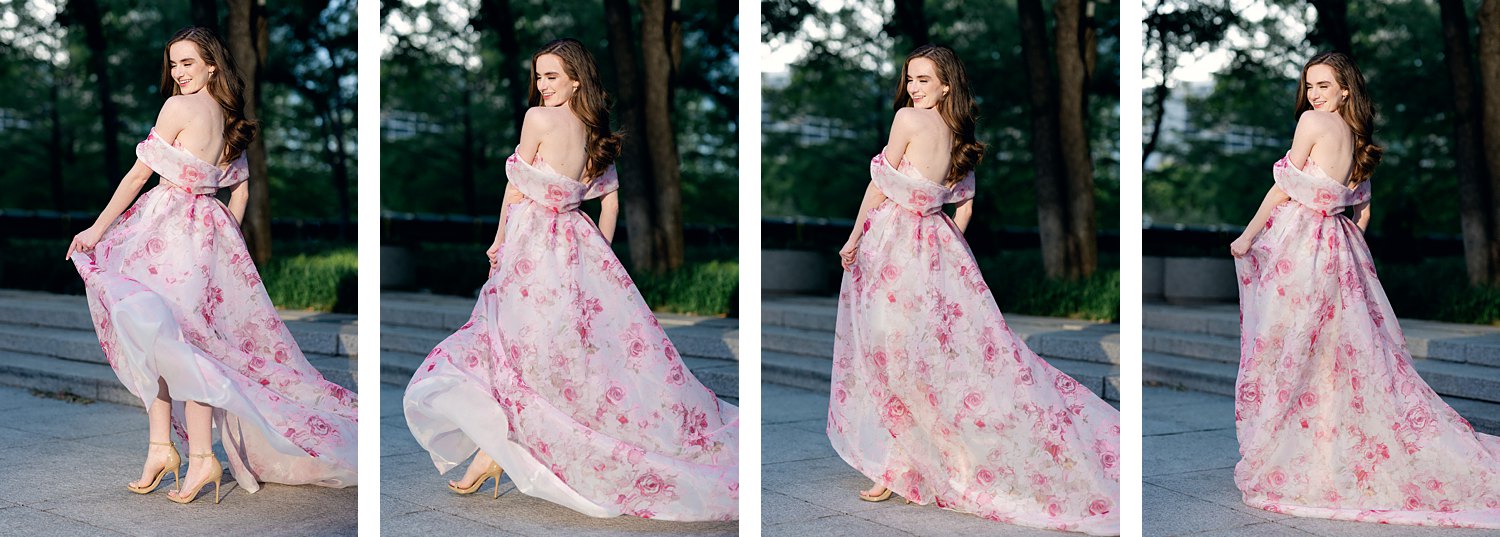 smiling woman in Pink floral gown twirling