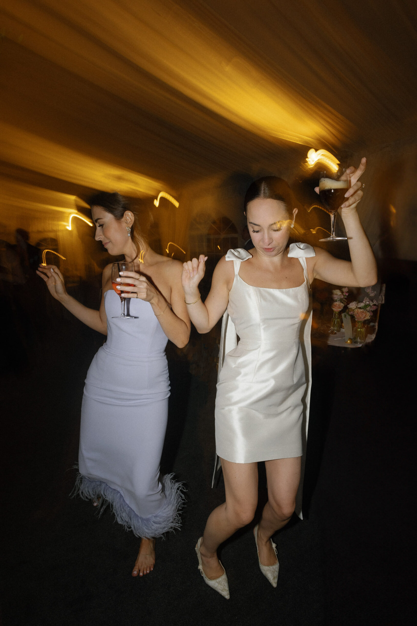 bride dancing with guest at wedding reception shutter drag