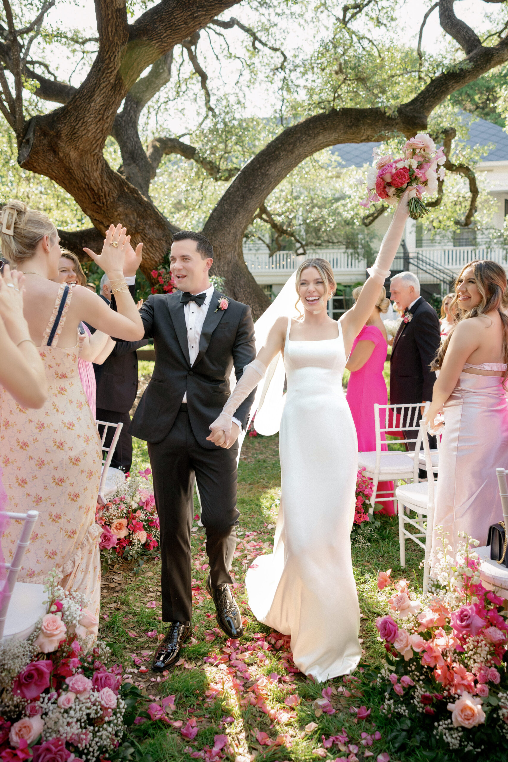 Bride and groom at their pink-themed wedding in Austin, Texas at Hotel Saint Cecilia and Skybox on 6th.